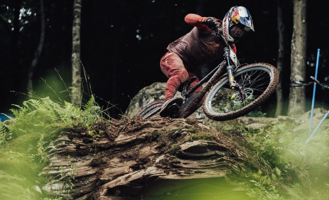 Finn Iles rides over a steep rock in Snowshoe, West Virginia