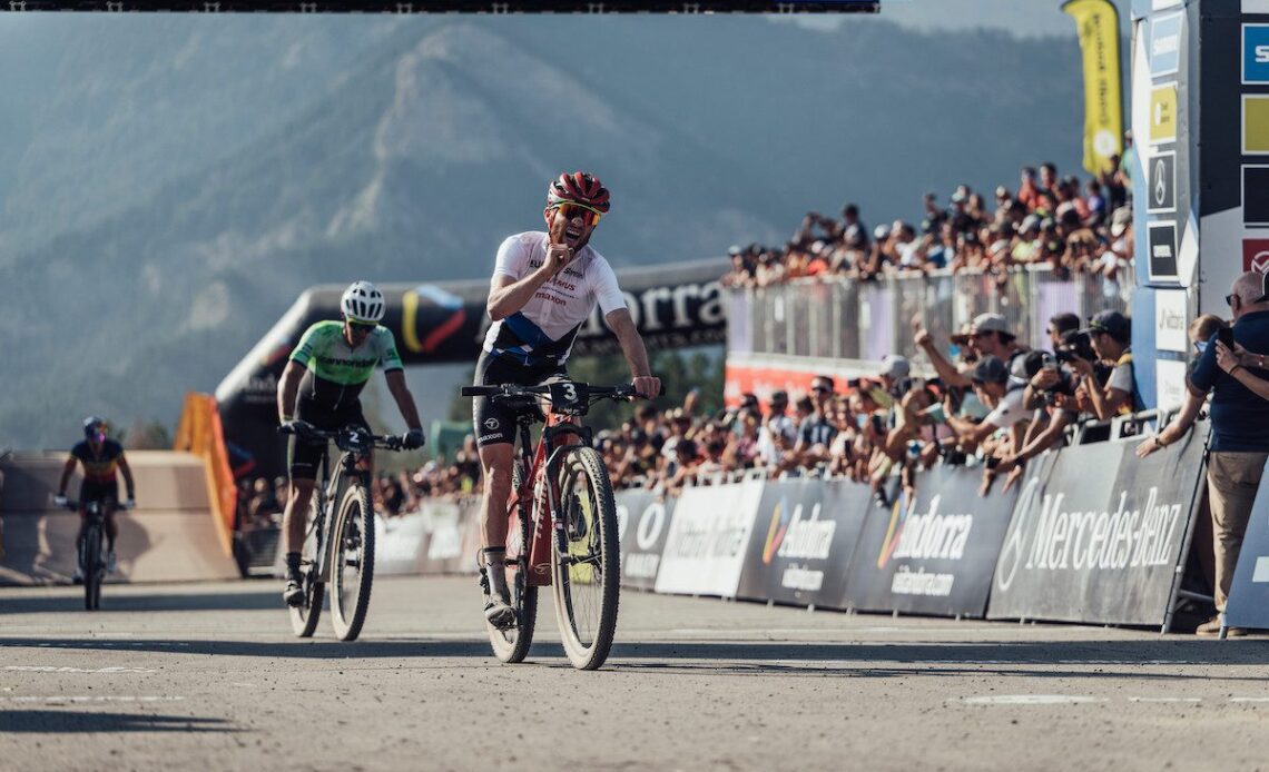 Mathias Flueckiger celebrates a World Cup short track win