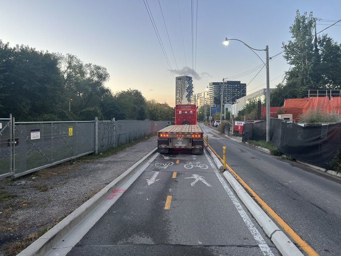 A truck parked in a bike lane and threatened a cyclist when asked to move