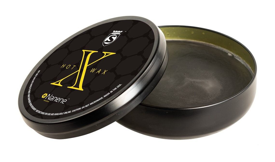 A pot of black wax in a black tin