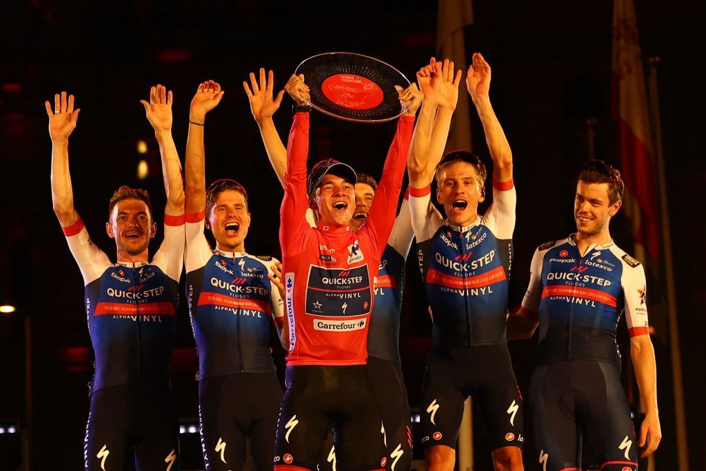 Belgian Remco Evenepoel and teammates of QuickStep Alpha Vinyl celebrate the overall victory in the 2022 Vuelta a España