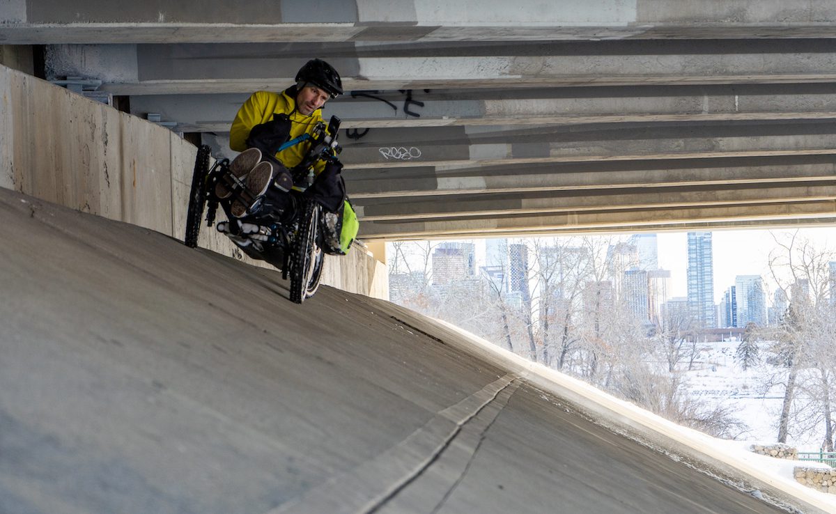 Christian Bagg rides up the side of an underpass on his daily commute in Calgary, Alta.