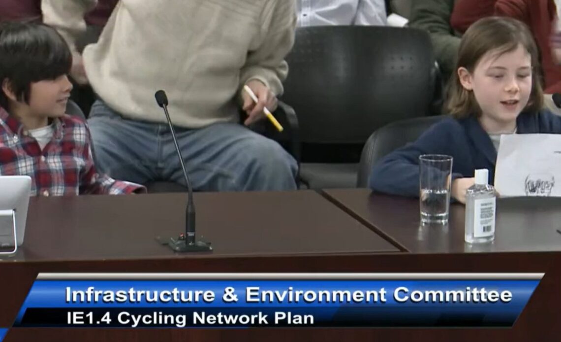 Two kids read to Toronto City Council about bike lanes