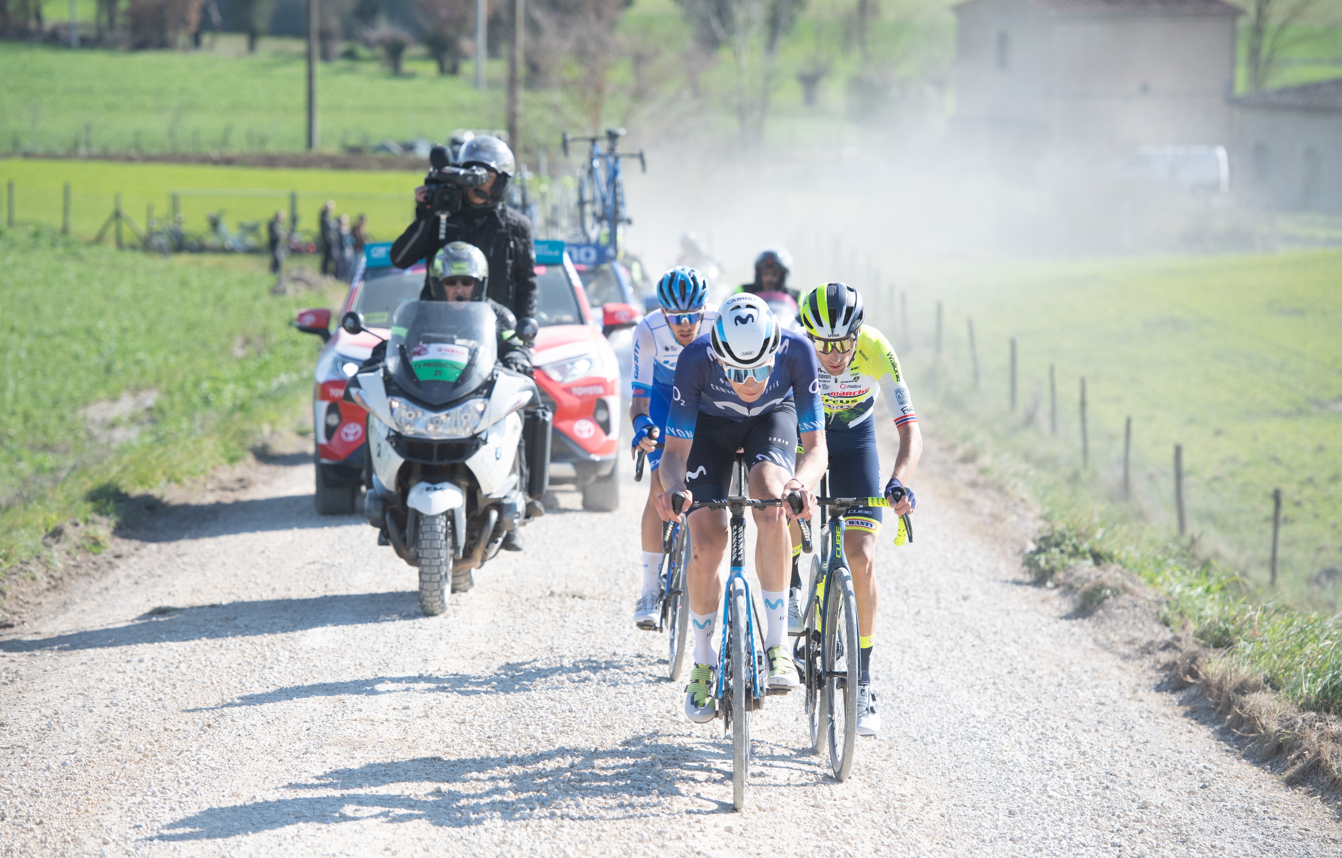 Three riders in the breakaway on a gravel section of Strade Bianche