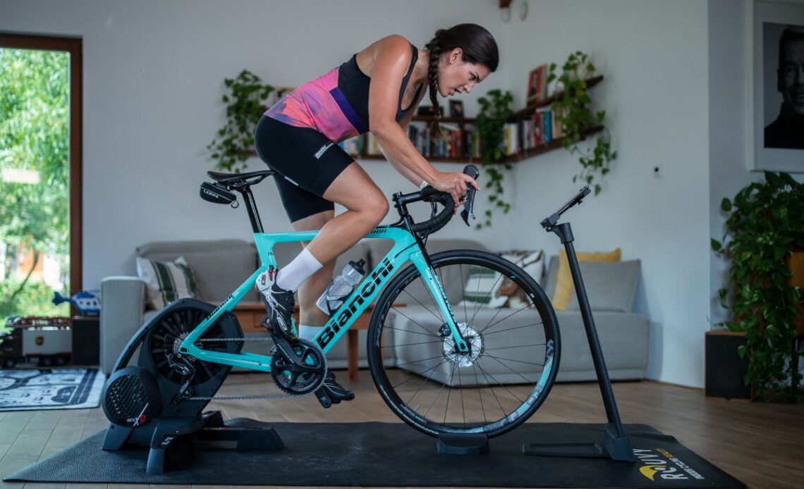 A female riding using an indoor trainer