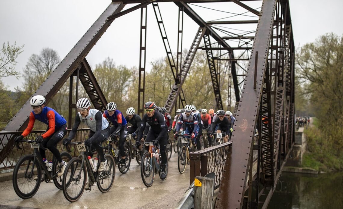 The peloton crosses a bridge at Paris to Ancaster