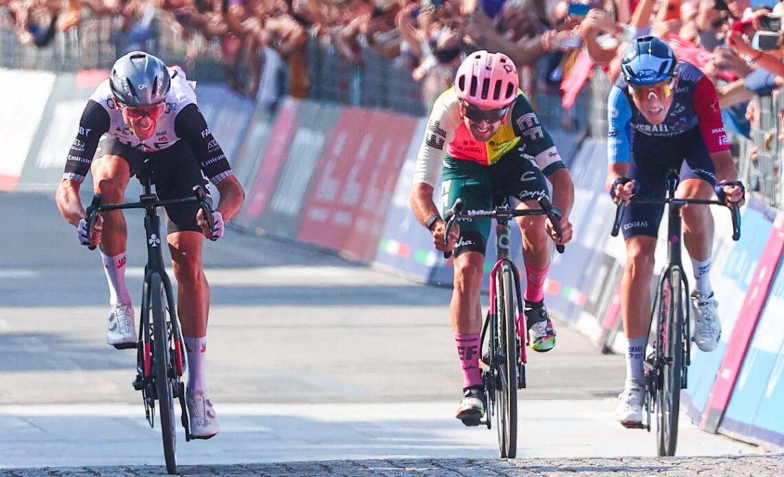 Breakaway trio Brandon McNulty, Ben Healy, and Marco Frigo race to the line on stage 15 of the Giro d