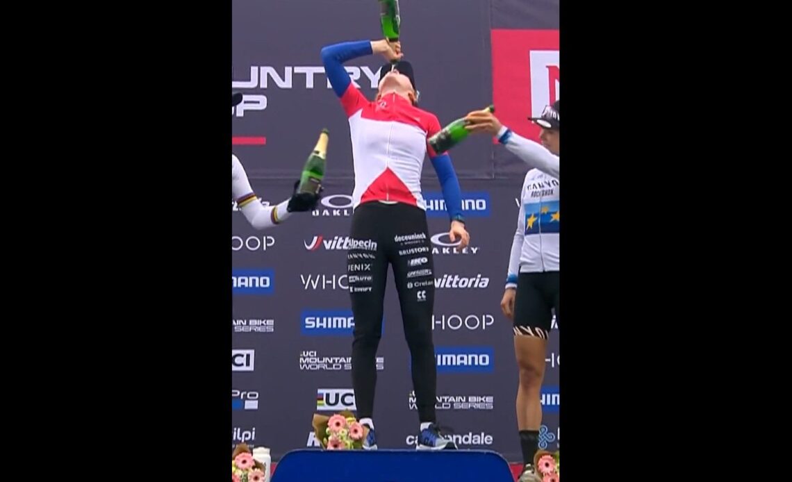 Puck Pieterse drinking champagne on the podium