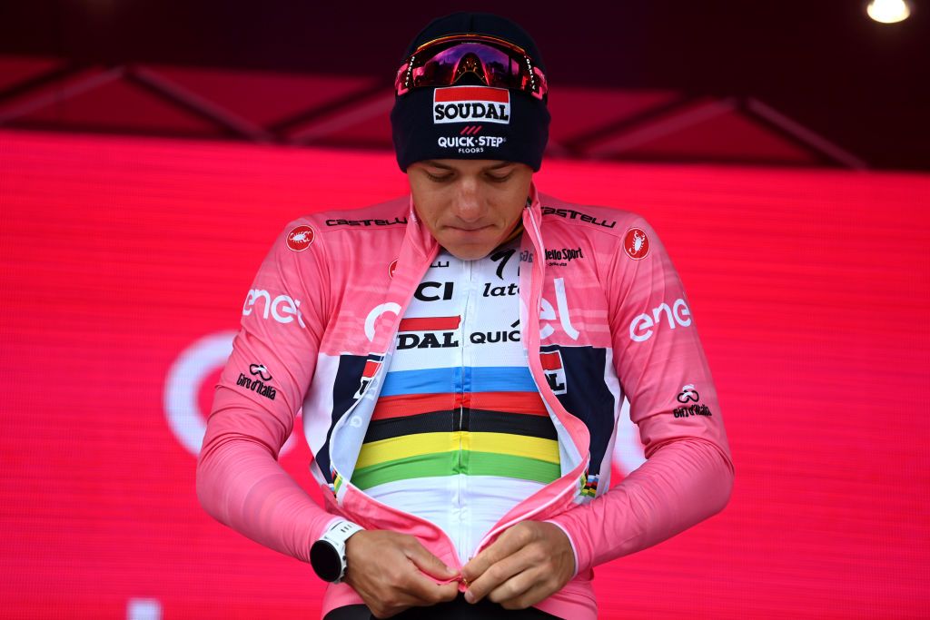 Remco Evenepoel (Soudal-QuickStep) zips on the maglia rosa after stage 9 of the Giro d