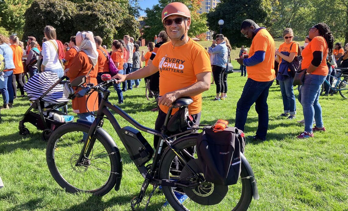 Arcy Canumay poses with his ebike.