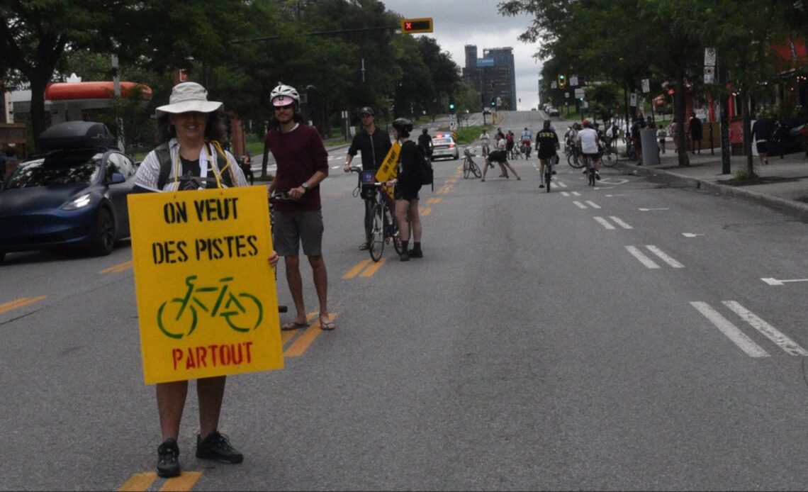 Montreal cyclists create 'human bike lane' to raise awareness about safety