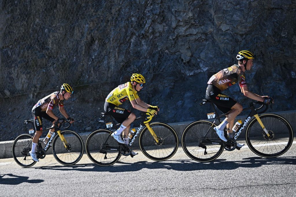 JumboVisma teams Slovenian rider Primoz Roglic L JumboVisma teams Danish rider Jonas Vingegaard wearing the overall leaders yellow jersey and JumboVisma teams American rider Sepp Kuss cycle in the ascent of Alpe dHuez during the 12th stage of the 109th edition of the Tour de France cycling race 1651 km between Briancon and LAlpedHuez in the French Alps on July 14 2022 Photo by AnneChristine POUJOULAT AFP Photo by ANNECHRISTINE POUJOULATAFP via Getty Images