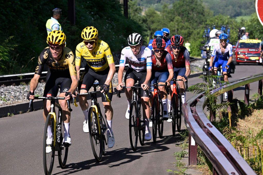 Sepp Kuss leads Jonas Vingegaard and Tadej Pogacar on the Puy de Dome at the 2023 Tour de France.