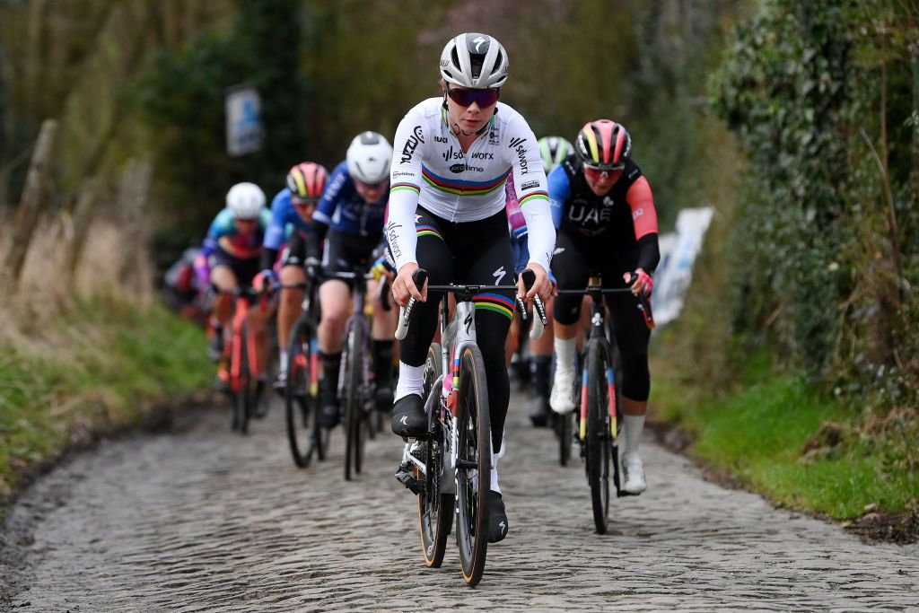 Lotte Kopecky races through a cobblestones sector during the 16th Omloop Het Nieuwsblad 2024