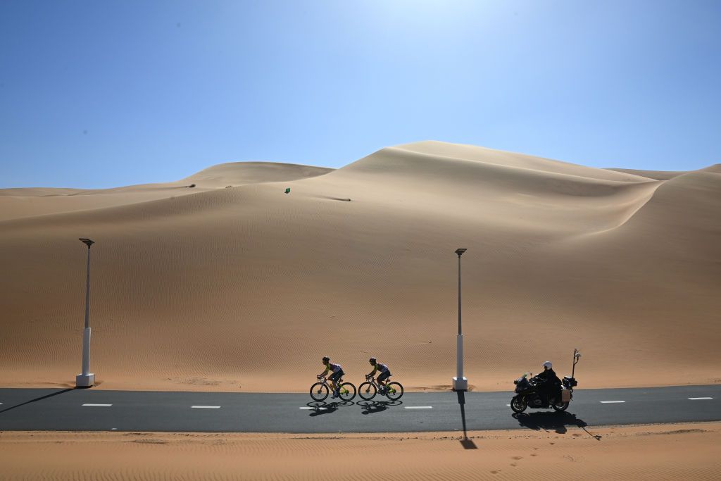 LIWA UNITED ARAB EMIRATES FEBRUARY 19 A general view Mark Stewart of Great Britain and Marco Murgano of Italy and Team CorratecVini Fantini through a landscape in the desert during the 6th UAE Tour 2024 Stage 1 a 141km stage from Al Dhafra Walk Madinat Zayed to Liwa UCIWT on February 19 2024 in Liwa United Arab Emirates Photo by Tim de WaeleGetty Images