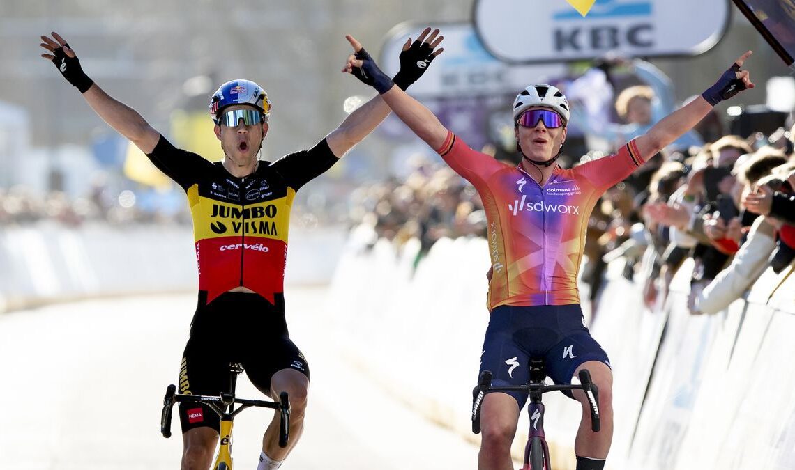 Belgian Wout Van Aert of Team Jumbo-Visma celebrates as he crosses the finish line to win the men