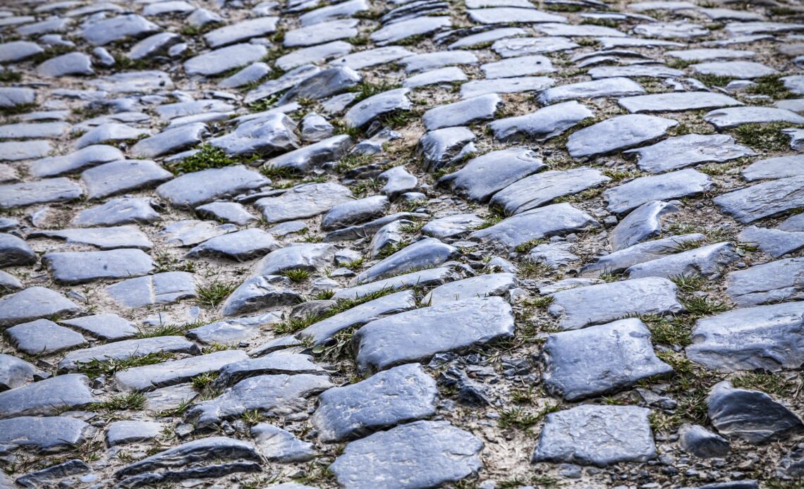 Detail of a cobbelstone road located in the North of France near Lille. On such roads every year is organized one of the most famous one day cycling race Paris-Roubaix.