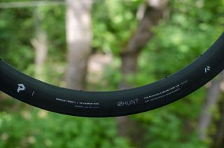 A close up of a Hunt carbon rim, showing the 'Sustain Phase 1' branding