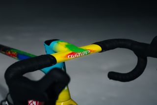 The vibrant yellow, blue, green and red of the one piece bar and stem