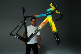 Mark Cavendish taking a moment to appreciate his new bike