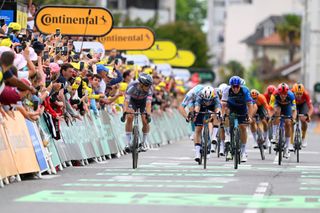 PAU FRANCE JULY 12 LR Stage winner Jasper Philipsen of Belgium and Team Alpecin Deceuninck Wout Van Aert of Belgium and Team Visma Lease a Bike and Pascal Ackermann of Germany and Team Israel Premier Tech sprint at finish line during the 111th Tour de France 2024 Stage 13 a 1653km stage from Agen to Pau UCIWT on July 12 2024 in Pau France Photo by Dario BelingheriGetty Images