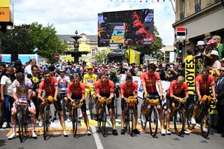 Uno-X Mobility lead a moment of silence for Norwegian rider Andre Drege who died at the Tour of Austria 2024