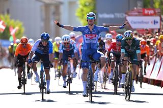 OUREM PORTUGAL AUGUST 18 Kaden Groves of Australia and Team Alpecin Deceuninck celebrates at finish line as stage winner ahead of LR Corbin Strong of New Zealand and Team Israel Premier Tech and Wout van Aert of Belgium and Team Visma Lease a Bike Green Points Jersey during the 79th La Vuelta Ciclista a Espana 2024 Stage 2 a 194km stage from Cascais to Ourem UCIWT on August 18 2024 in Ourem Portugal Photo by Tim de WaeleGetty Images