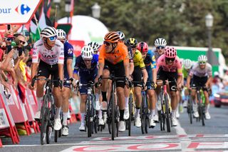 The pack crosses the finish line at the end of the stage 6 of La Vuelta a Espana cycling tour, a 185.5 km race between Jerez de la Frontera and Yunquera, on August 22, 2024. (Photo by CRISTINA QUICLER / AFP)