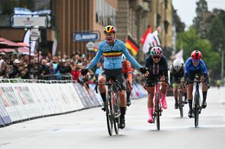 Belgium's Lotte Kopecky crosses the finish line and wins the women's Elite Road Race cycling event during the UCI 2024 Road World Championships, in Zurich, on September 28, 2024. (Photo by Fabrice COFFRINI / AFP)