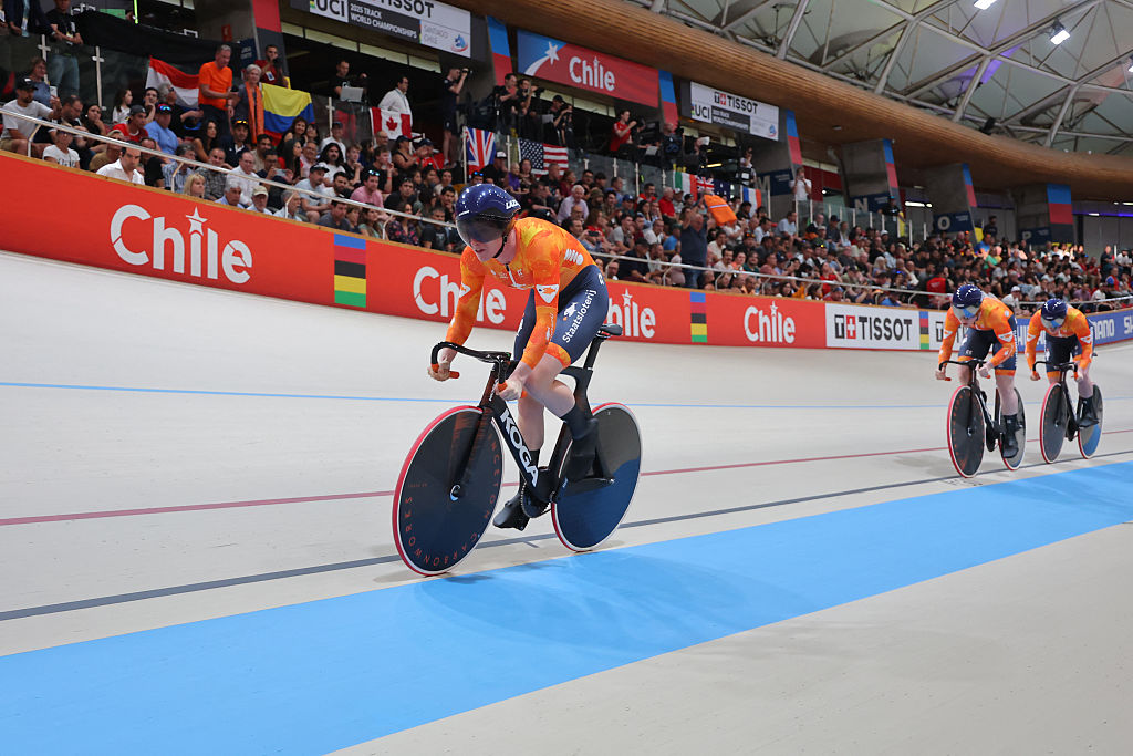Netherlands' #121 Kimberly Kalee, #122 Hetty Van de Wouw and #123 Steffie Van der Peet compete in the women's team sprint first round during the 2025 UCI Track World Championships at the Penalolen Velodrome, in Santiago, on October 22, 2025. (Photo by Javier TORRES / AFP)