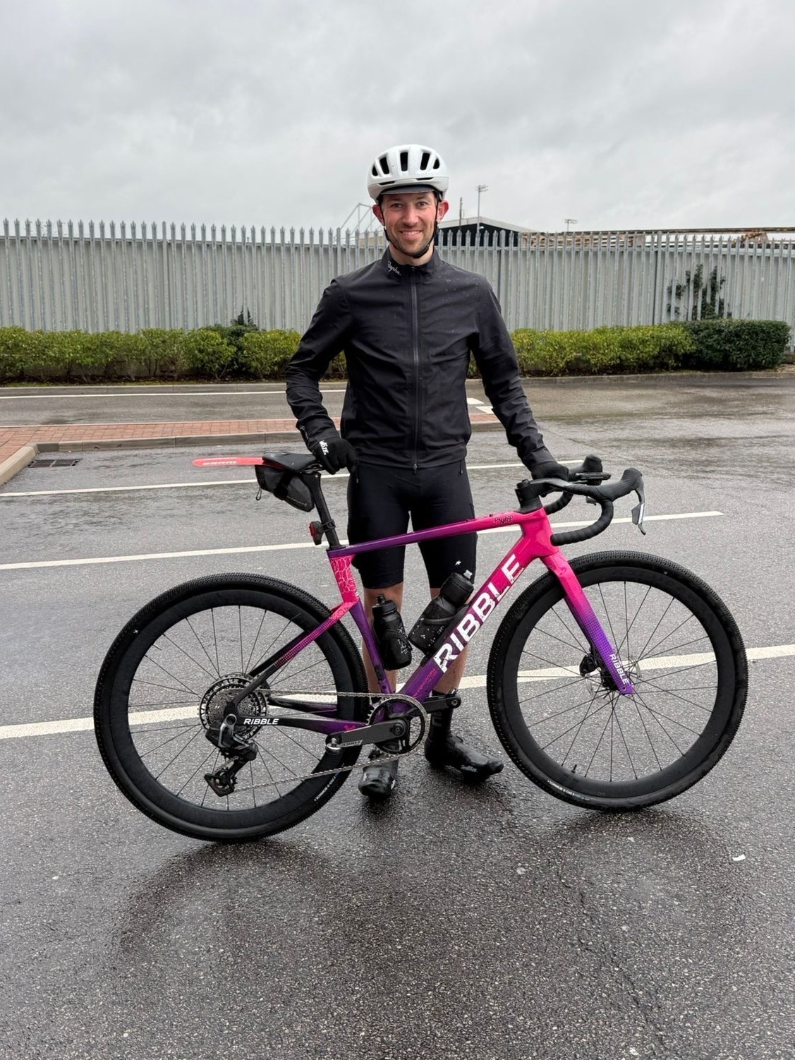 A man standing with a Ribble gravel bike 