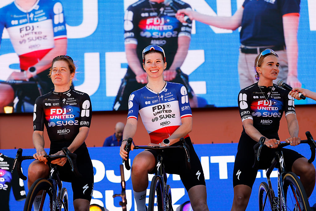 ADELAIDE, AUSTRALIA - JANUARY 16: (L-R) Amber Kraak of the Netherlands, Marie Le Net of France and Ally Wollaston of New Zealand and Team FDJ United - SUEZ during the 26th Santos Tour Down Under 2026, Team Presentation on January 16, 2026 in Adelaide, Australia. (Photo by Con Chronis/Getty Images)