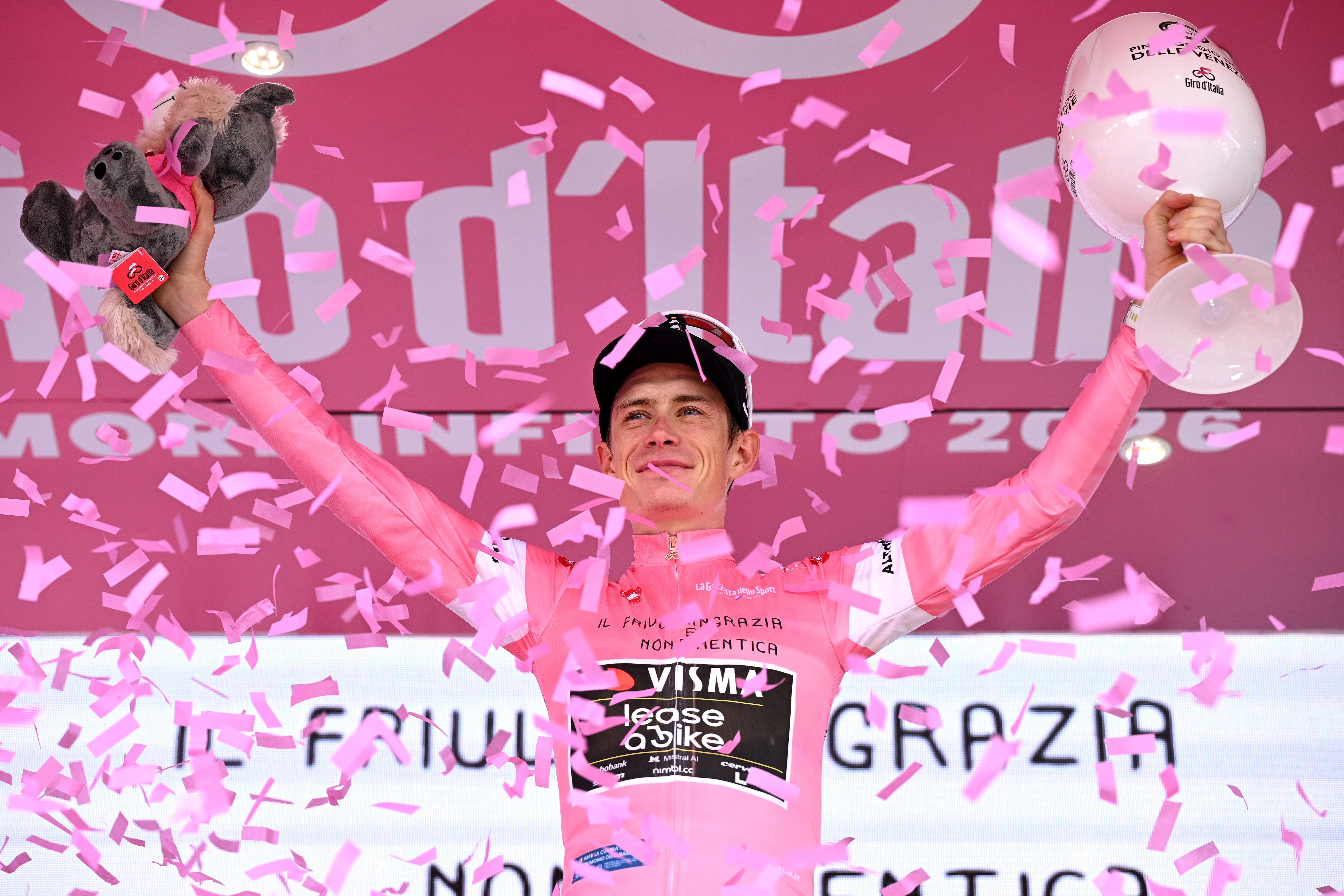 PIANCAVALLO, ITALY - MAY 30: Jonas Vingegaard of Denmark and Team Visma | Lease a Bike celebrates at podium as Pink Leader Jersey winner during the 109th Giro d'Italia 2026, Stage 20 a 200km stage from Gemona del Friuli to Piancavallo 1289m / #UCIWT / on May 30, 2026 in Piancavallo, Italy. (Photo by Dario Belingheri/Getty Images)