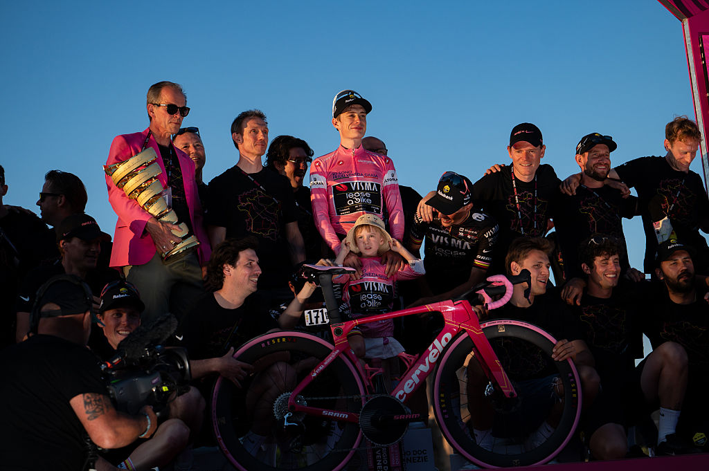 Team Visma | Lease a Bike's General Manager and CEO Richard Plugge, overall race winner Jonas Vingegaard of Denmark, and teammates Victor Campenaerts of Belgium, Timo Kielich of Belgium, Sepp Kuss of the United States, Bart Lemmen of the Netherlands, Davide Piganzoli of Italy, Tim Rex of Belgium, along with team staff, celebrate on the podium as the final best team prize winners during the 109th Giro d'Italia 2026, Stage 21, a 131km stage from Rome to Rome, on May 31, 2026, in Rome, Italy. (Photo by Massimo Valicchia/NurPhoto)